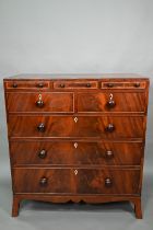 A Victorian mahogany chest of three shallow drawers over two short and three long graduated drawers,