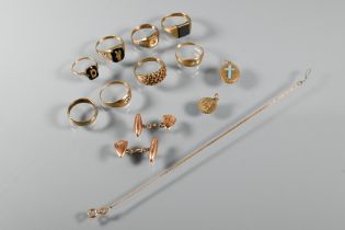 A collection of various 9ct yellow gold items including rings, St Christopher pendant, shield-shaped