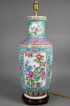 A 20th century Chinese famille rose turquoise and pink ground rouleau vase (mounted as a lamp) on
