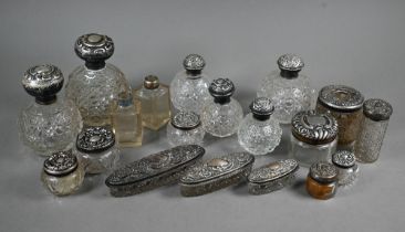 Nineteen various silver-mounted toilet bottles and jars