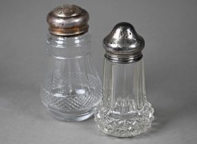 Two cut glass sugar casters with silver tops