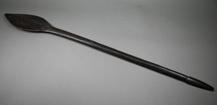An antique Polynesian carved wood throwing club, the paddle-shaped head with raised midrib and