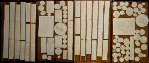 A collection of vintage cast plaster replicas of the Parthenon Marble friezes, in the manner of John