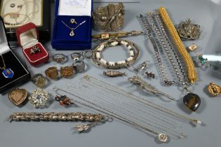 A collection of vintage and modern costume jewellery including chains, necklaces, rings, brooches