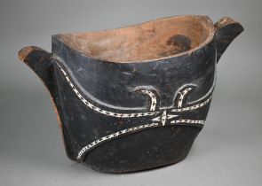 A Polynesian (possibly Solomon Islands) carved and painted wood two-handled vessel inlaid with