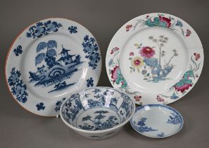 An 18th century Delft blue and white plate, painted with lakeside pagoda, 23.5 cm to/w an 18th