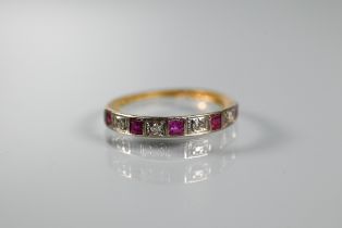 An 18ct yellow gold half eternity ring set rubies and diamonds, size M 1/2, shank worn
