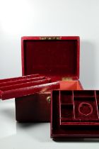 A dark red jewel case with dark red velvet-lined fitted interior and two lift out trays, Bramah lock