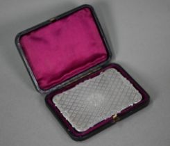 A Victorian visiting card case with engraved tartan-style decoration and scrolling edges, Edward