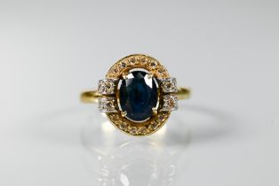 An oval sapphire and diamond cluster ring, 18ct yellow gold set, size N, approx 4.4g all in