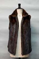 A vintage 1970s brown fur gillet, with zippered front, size 10/12