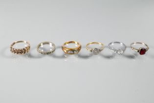 An Edwardian 18ct and platinum ring set small diamonds, size N to/w five other dress rings (6)