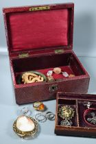 Red morocco jewel box with collection of vintage jewellery items including oval shell cameo