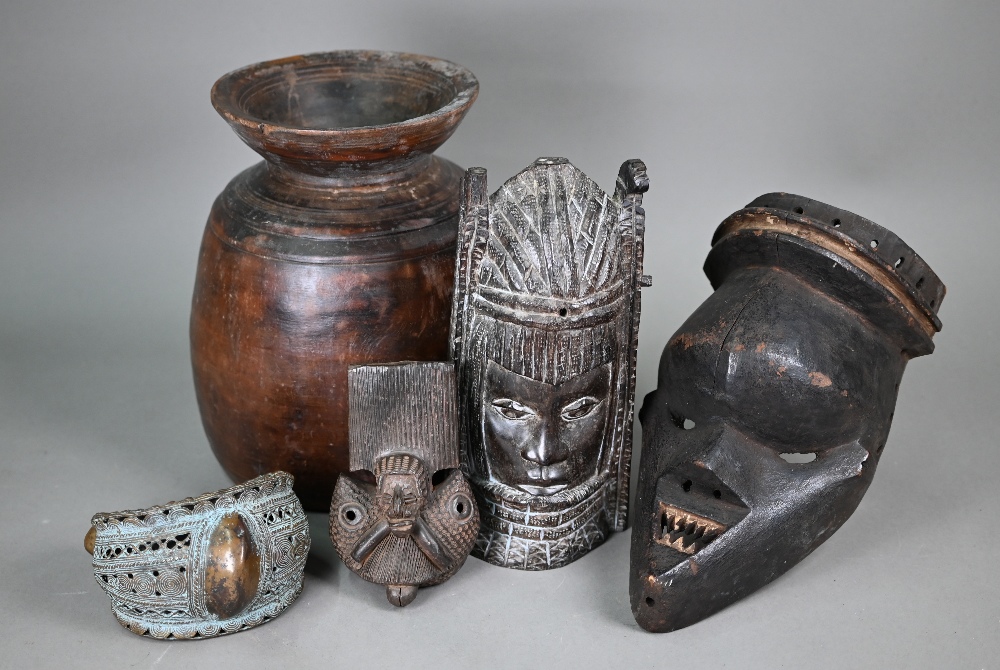 An antique African (probably Congo) tribal mask, with shapened teeth and pronounced forehead