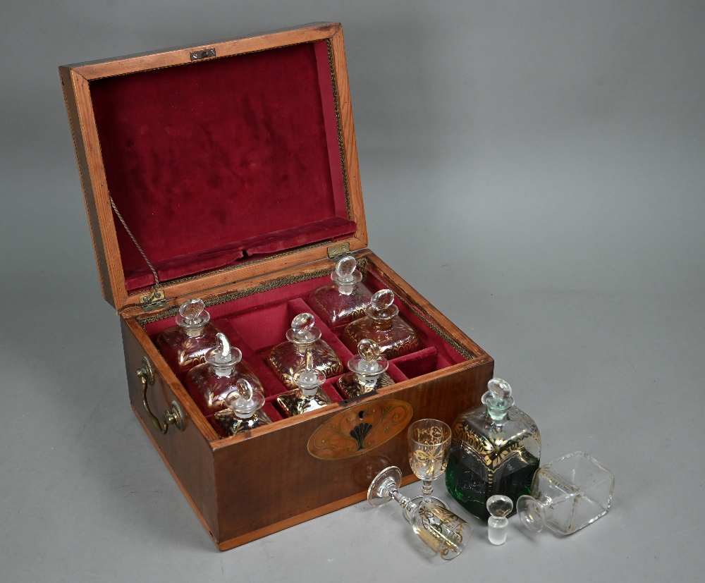 A 19th century boxwood and walnut liqueur bottle case (made up), the interior containing ten near-