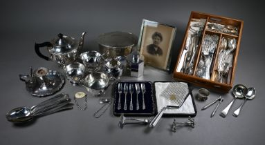 A Victorian silver plated chamberstick, an oval biscuit box, an unusual American Birk's Regency