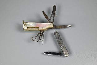 Two small pocket knives, one mother of pearl cased with various implements, the other engine