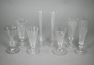 A pair of 19th century slender glass flute glasses with foliate etched decoration and ground-out