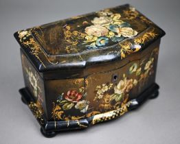 A Victorian lacquered papier maché tea caddy painted and gilded overall with flowers, on bun feet,