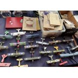 A collection of model aircraft together with a large collection of cigarette cards,