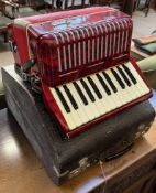 A Galotta piano accordion, with red crackle glaze body,