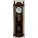 An oak cased Vienna regulator type wall clock,