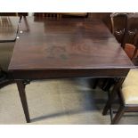 A 19th century mahogany tea table with a rectangular foldover top on square legs