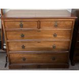 An Edwardian walnut chest with a rectangular top above two short and three long graduated drawers