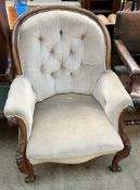 A Victorian walnut framed library chair, with an arched button upholstered back,