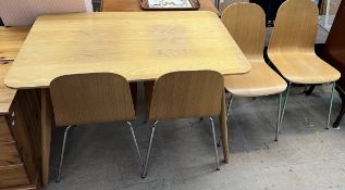 A modern kitchen dining table and four chairs