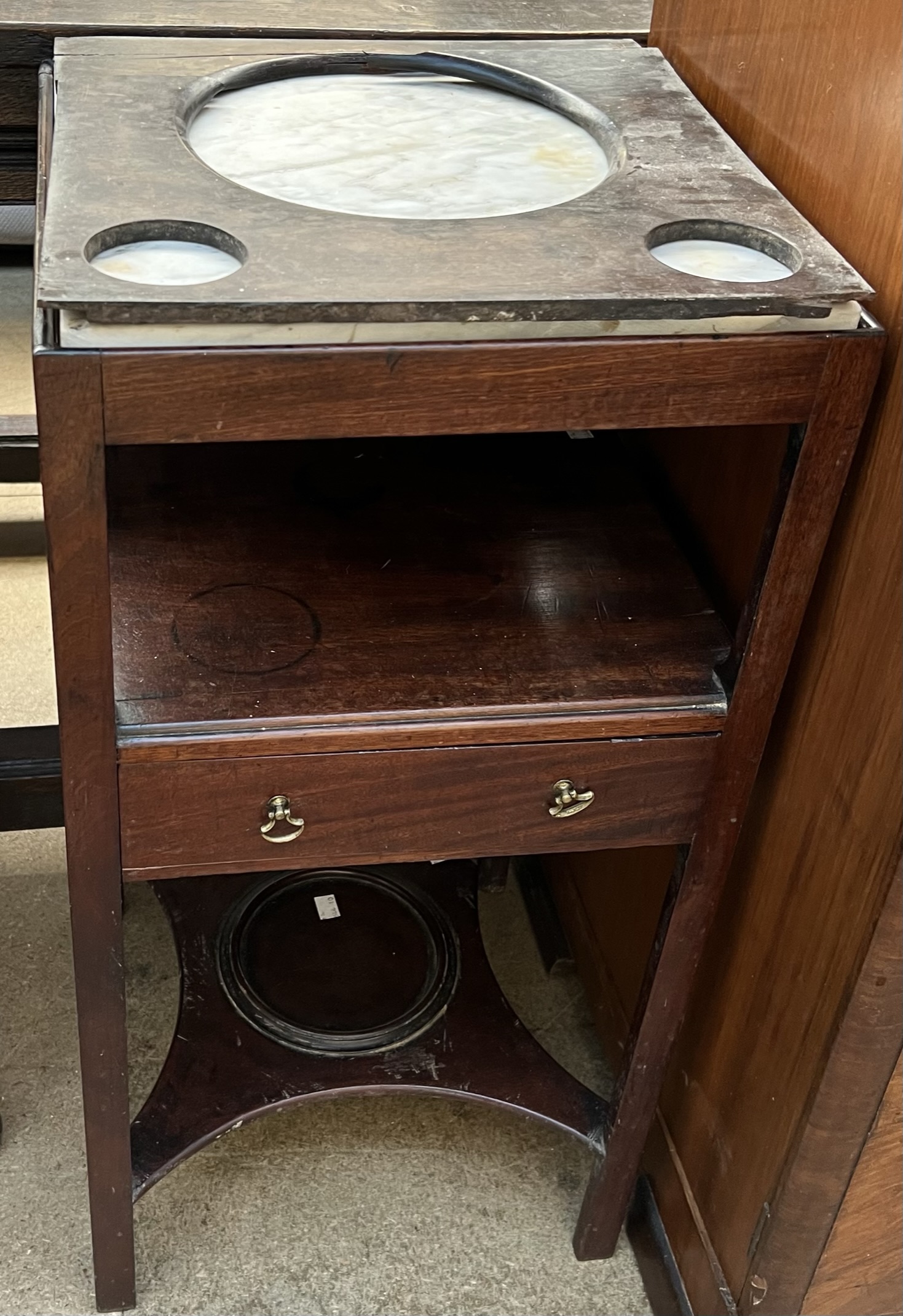 A George III mahogany washstand, of square form with replacement marble top,