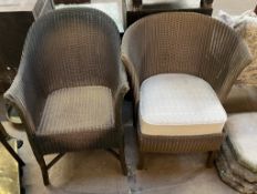 Two Lloyd Loom gold painted arm chairs