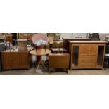 A collection of modern furniture including a sideboard, carved occasional table,