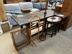 An oak occasional table, of oval form with barley twist legs together with an oak standard lamp,