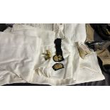 Military buttons together with white uniforms,