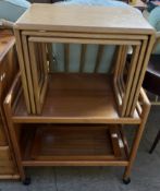 A light oak nest of three tables together with a teak tea trolley and a teak tray