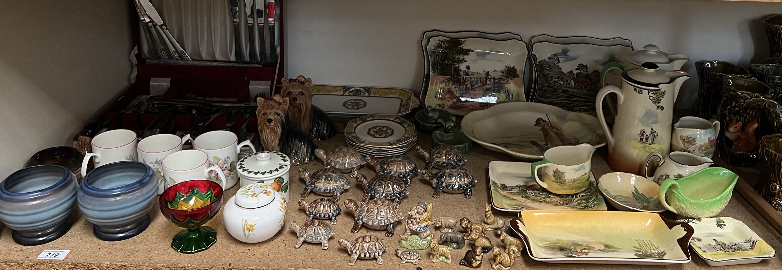 A collection of Royal Doulton series ware plates and jugs etc together with Wade figures,