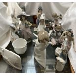 A collection of Lladro and Nao figures including Tahitian figures, angel, goose,