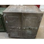 A panelled two door safe, the interior with a shelf and two drawers, with keys, 69.