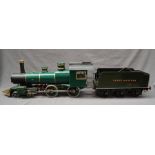 A live steam engine, in green livery together with a GWR tender in green, another tender,