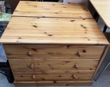 A pair of modern pine chests of drawers on plinth bases