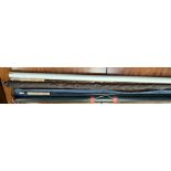 A Fenwick Iron Feather IF 999 9'9" fly fishing rod with cover and metal tube together with a