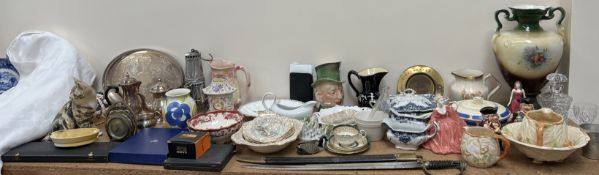 A sword together with a Smiths clock, Royal Doulton figures, Toby jugs, other pottery jugs, vases,