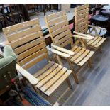 A set of three slat back folding chairs