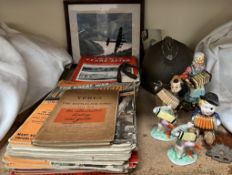 A military helmet together with The Great War magazines, other magazines, pottery figures,