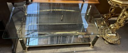 A glass topped coffee table,