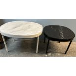 A white marble topped coffee table of oval form on cylindrical legs,