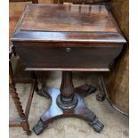 A Victorian rosewood teapoy the rectangular hinged top enclosing two lidded compartments and a