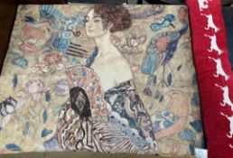 A wall hanging depicting a maiden holding a fan surrounded by birds and feathers together with a