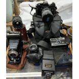 A Jenaflex AM-1 35mm camera together with various lenses,